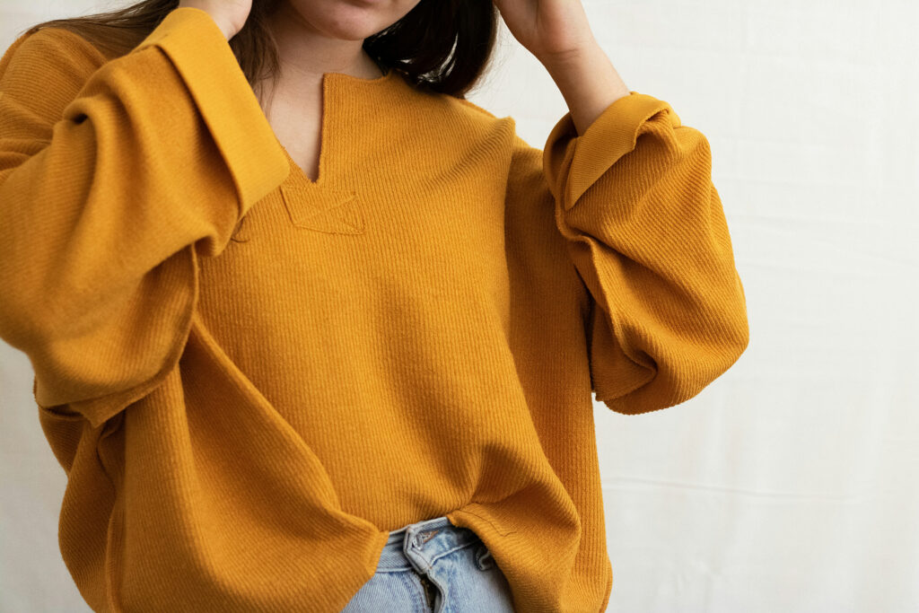woman wearing a mustard shirt